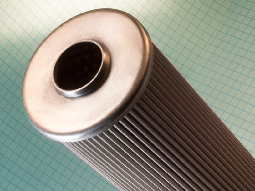 A large industrial metal oil filter